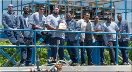 Water Plant Group Holding an Award