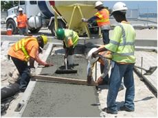 Construction Workers Pouring Concrete