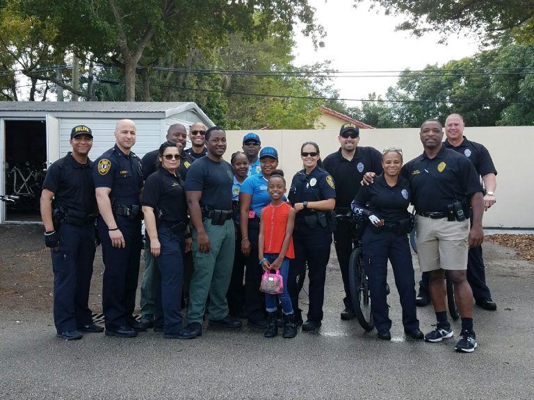 A group of people and police officers